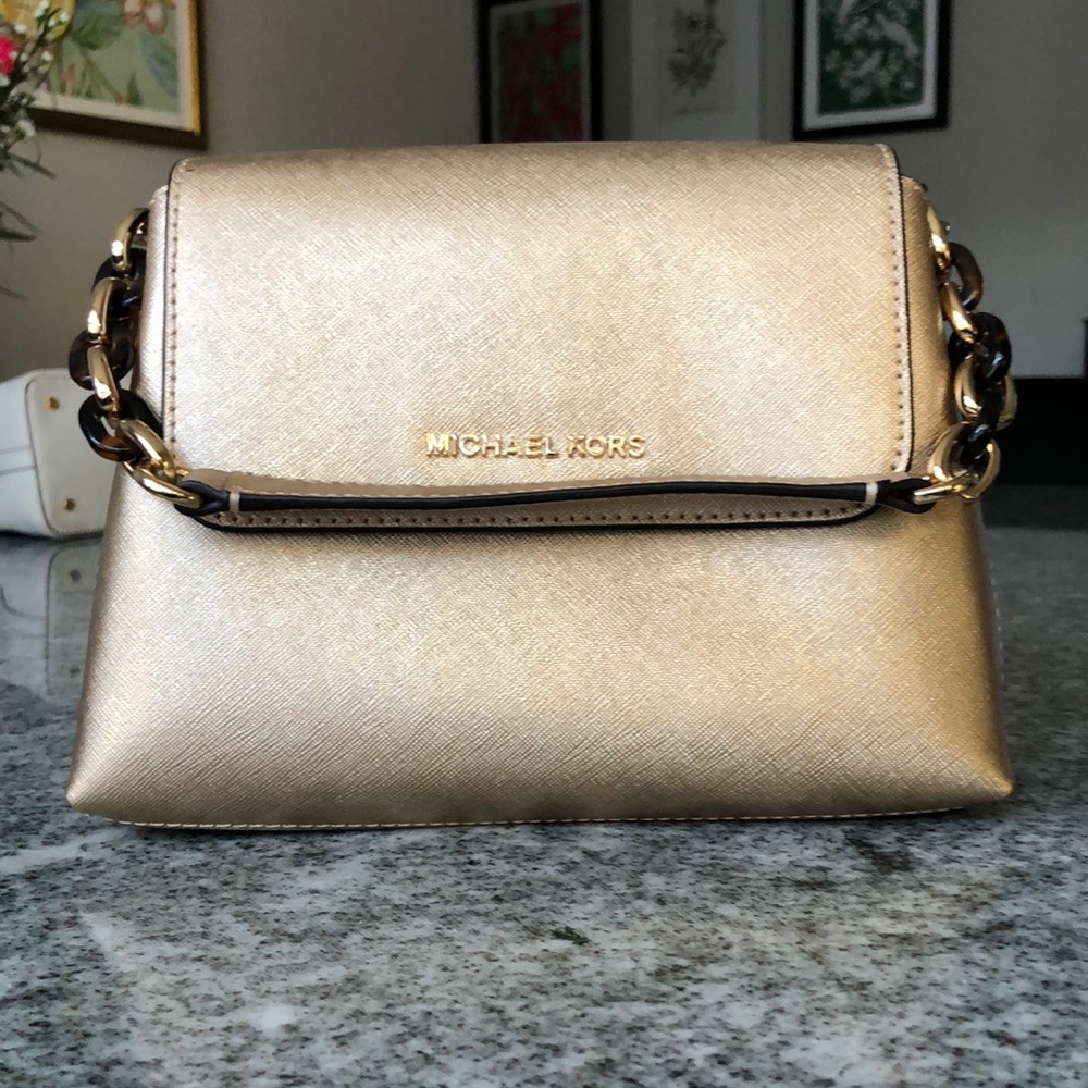 Michael Kors like new gold leather satchel with tortoise/gold handle.